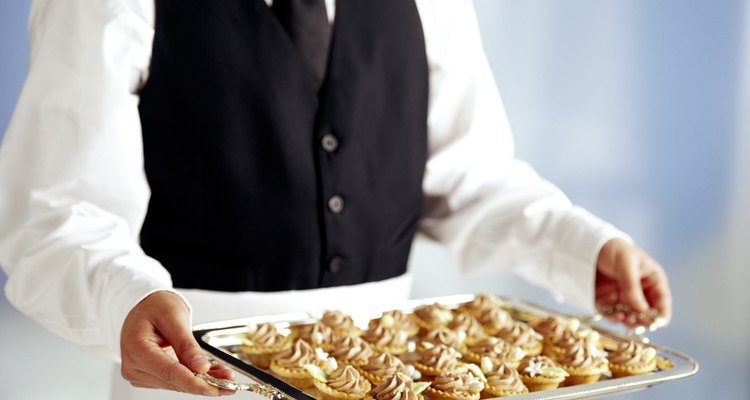 Waiter with tray of pastry