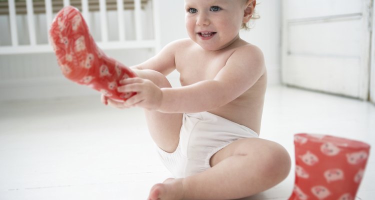 Baby Girl Putting on Galoshes