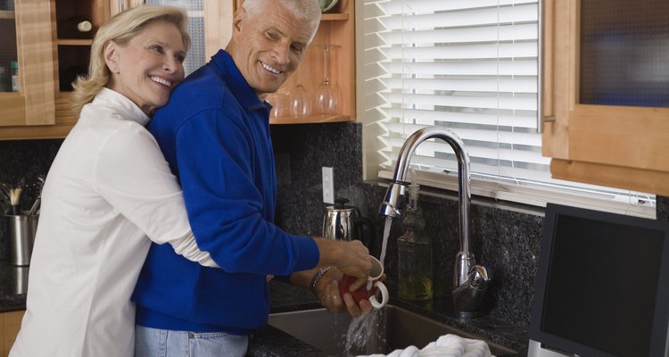 Woman embracing man at sink