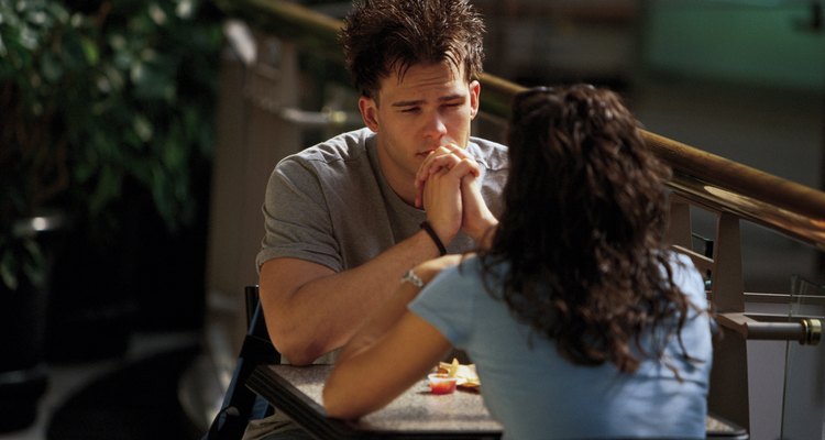 Teenagers sitting at table