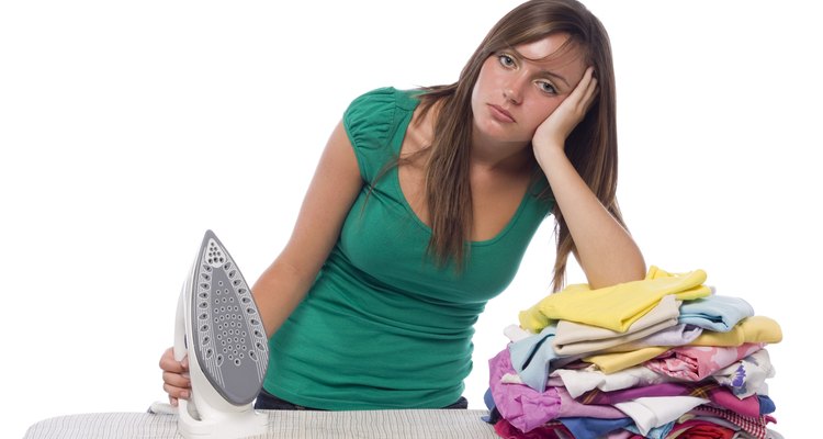 Girl with iron and laundry