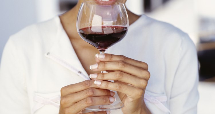 young woman drinking red wine