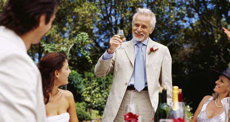mature man raising a toast at a wedding reception