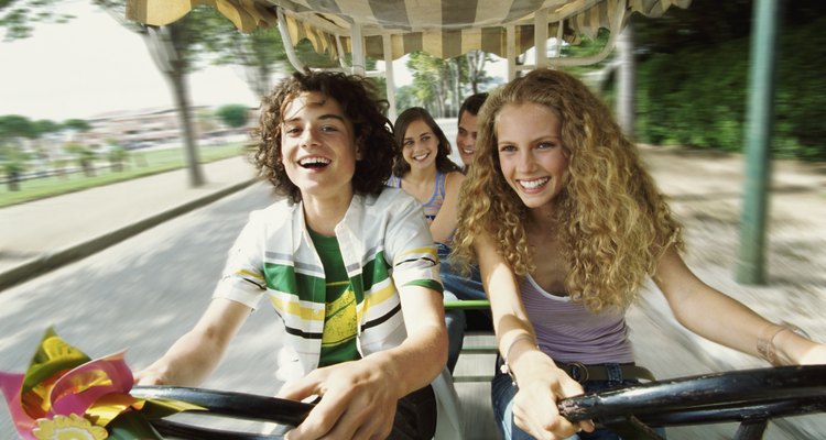 Teenage Boys and Girls Cycling With Their Friends in a Rickshaw