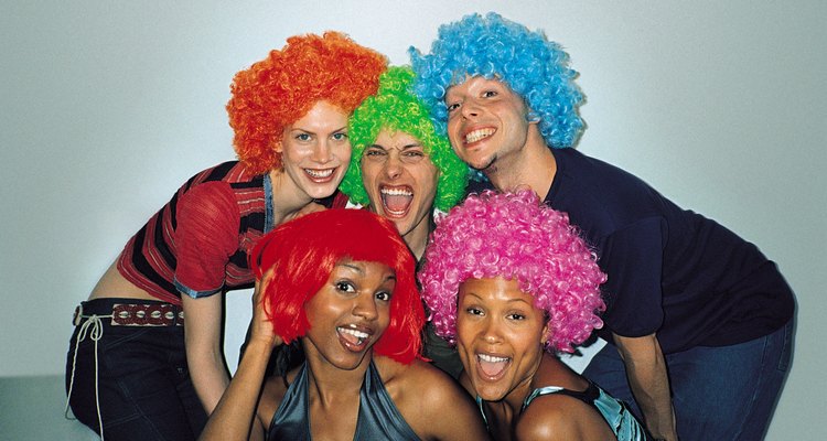 Group of friends wearing colored wigs