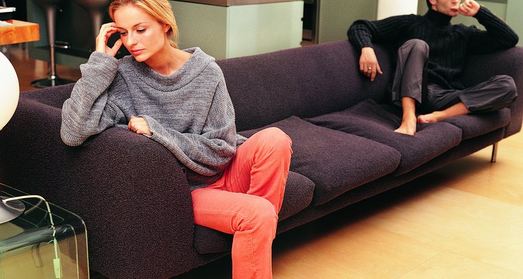 Upset Couple Sitting on a Sofa