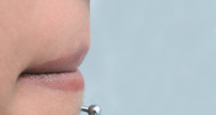 Person with nose stud and lip stud, extreme close-up