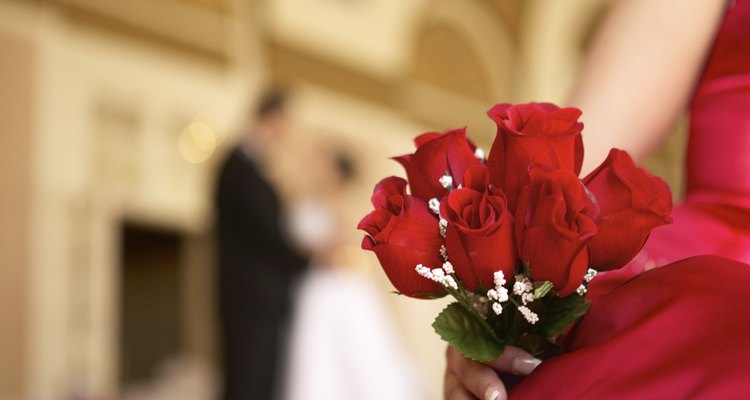 Woman holding flowers at a wedding