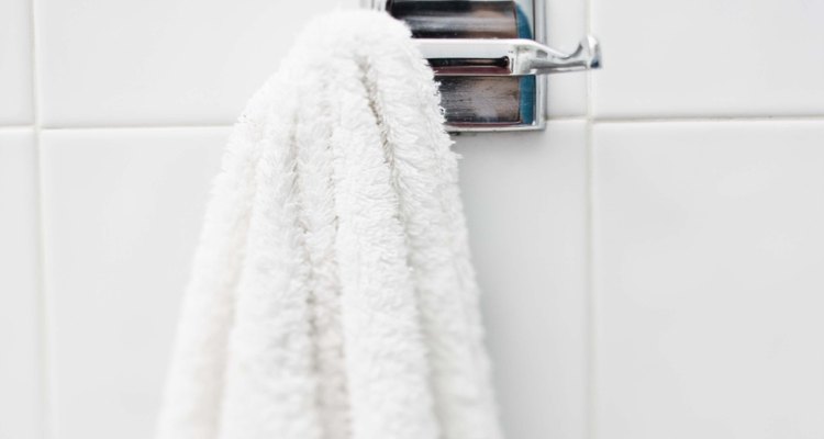 You can turn an everyday towel into a poncho to wear to the pool or beach.