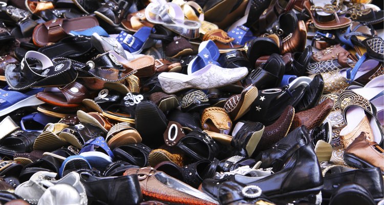 Shoes piled high in a market
