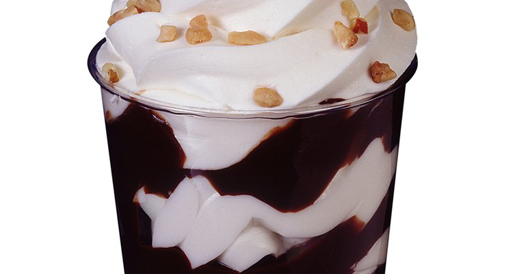 Heat chocolate and caramel coating in separate bowls.