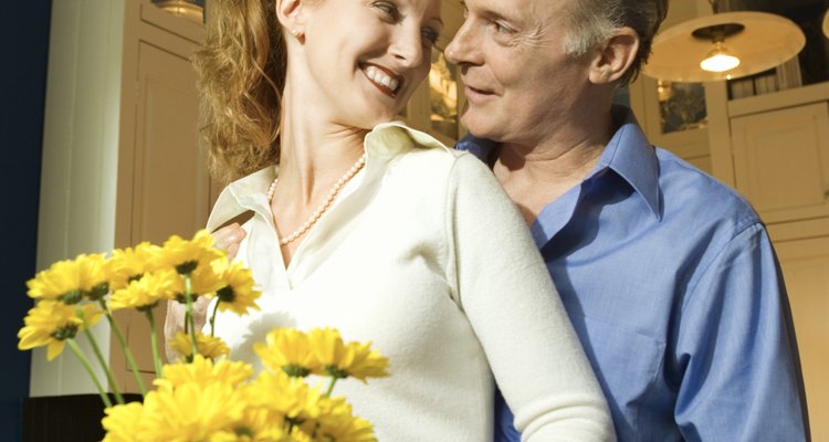 Couple arranging flowers