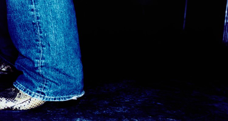 Close-up of Man in Snake Skin Boots and Blue Jeans