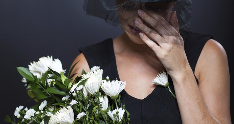 widow crying at funeral