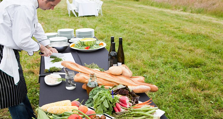 Chef preparing meal in a field