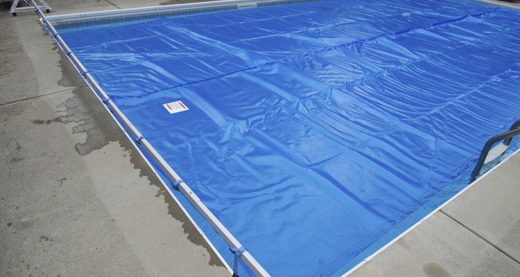 Solar pool cover on swimming pool