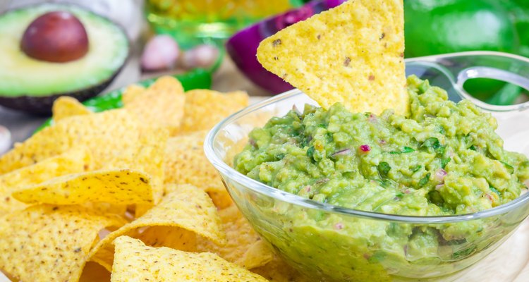 Bowl with chunky guacamole served with nachos