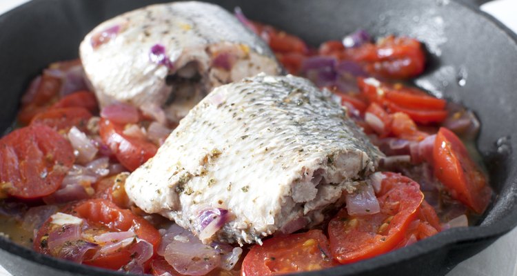 Sauteed bass pieces with tomatoes and onion