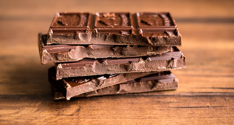 Stack of dark chocolate on a wooden table