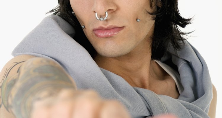 Portrait of a young man with facial piercing