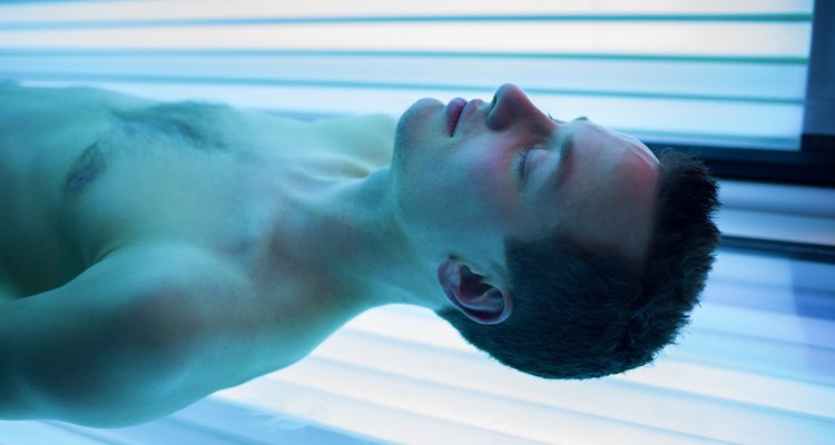 Handsome young man in a modern solarium