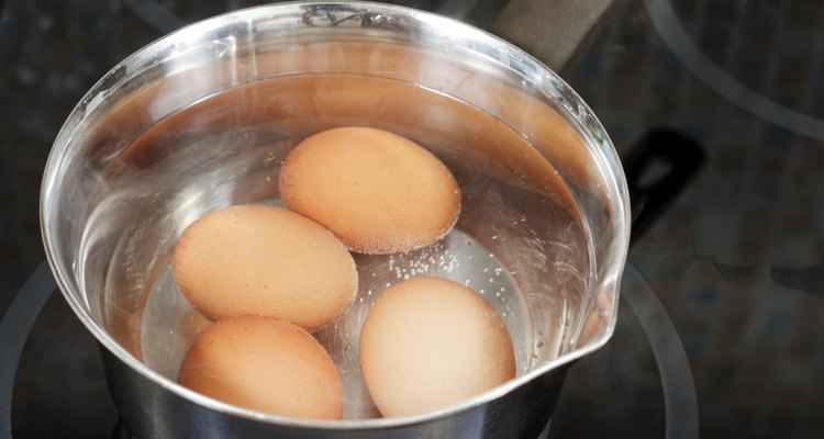 hen eggs are cooked in metal pot