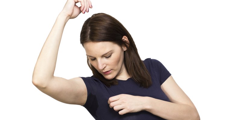 Woman sweating very badly under armpit