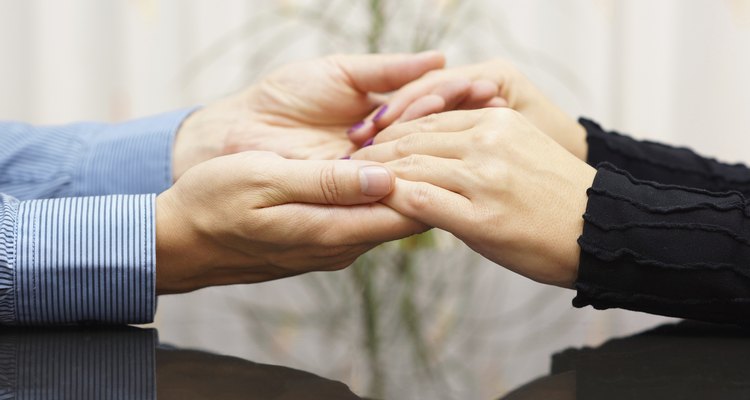 man  holding woman hands. love and care concept