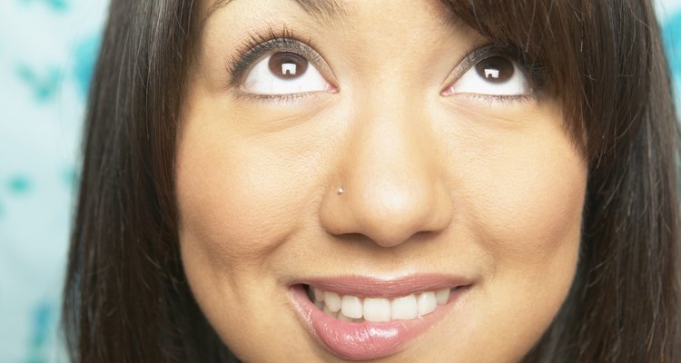 Close-up of a young woman looking up