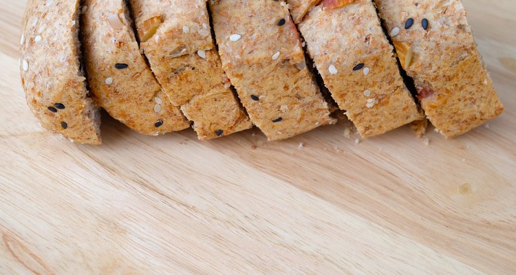 Sliced bread on wood background