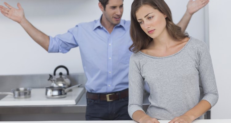 Man gesturing to wife during a dispute