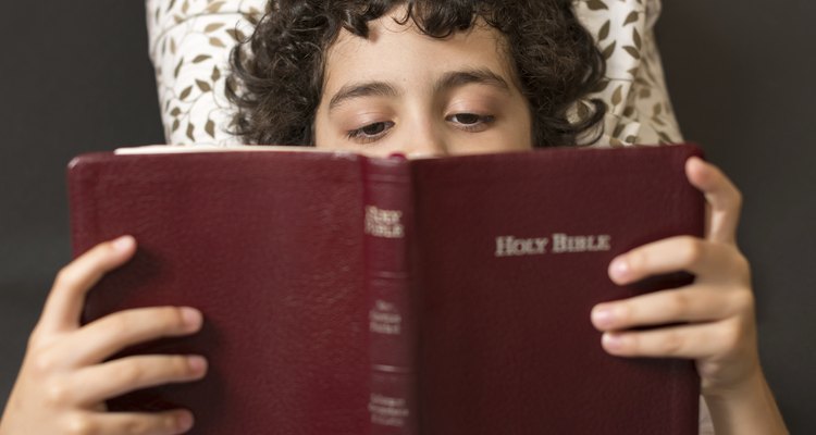 Hispanic boy reading the bible