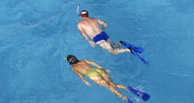 Two people snorkelling in tropics, elevated view, elevated view