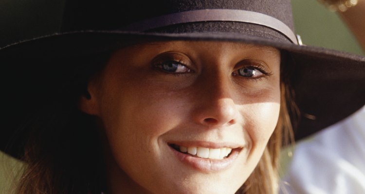 Young woman in felt hat, portrait