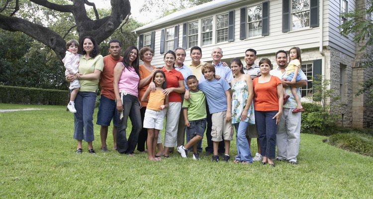 Portrait of a three generation family standing in a garden