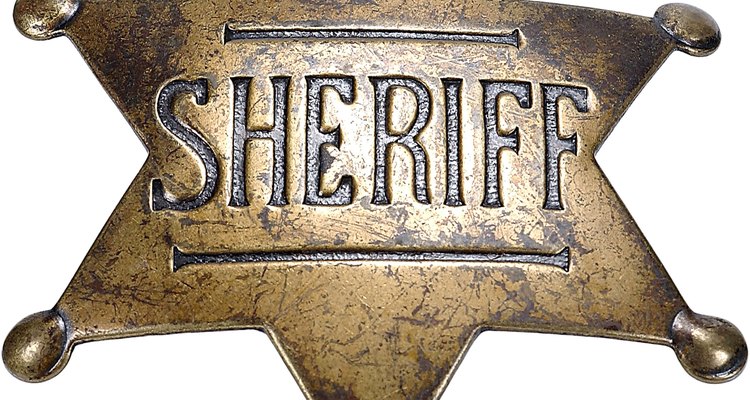 La placa del alguacil es una marca de honor en el viejo oeste.