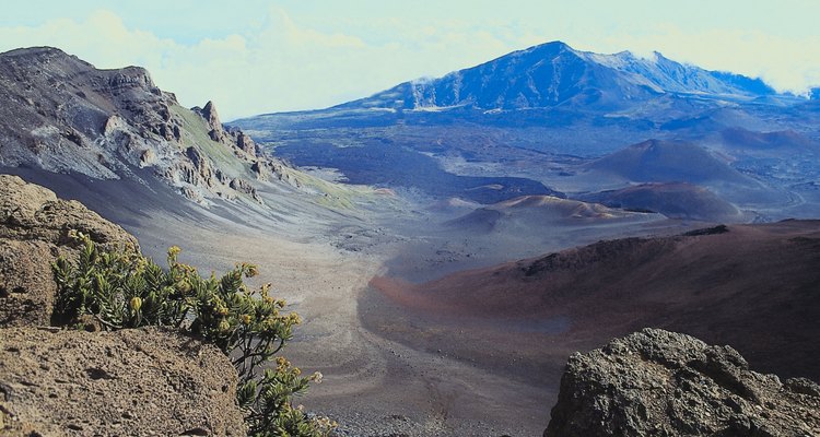 Make a papier-mache model of a volcano.