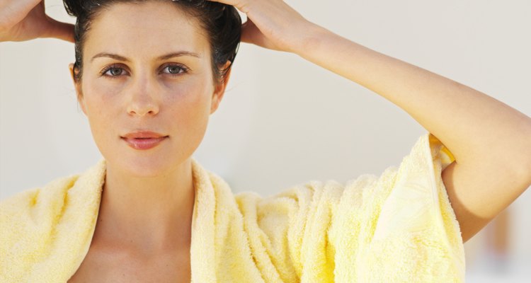 Front view portrait of a woman washing her hair