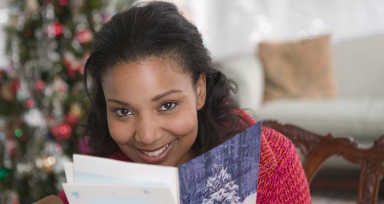 Woman reading Christmas card