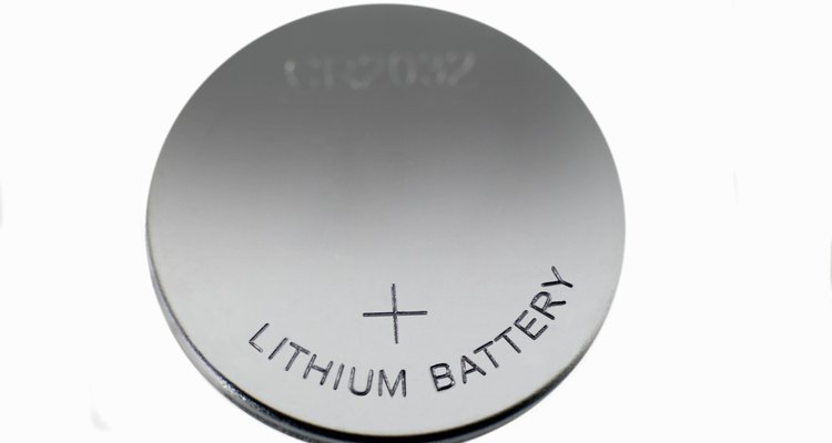 One side of a button cell battery is always marked with a