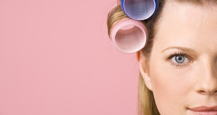 Cropped woman in curlers
