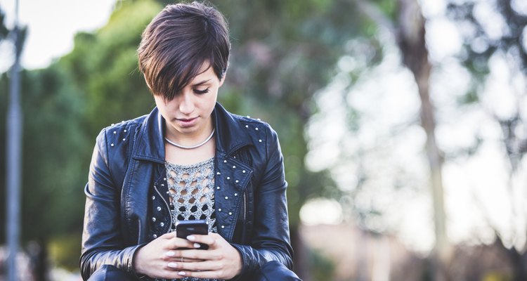 Girl Typing on Mobile Phone