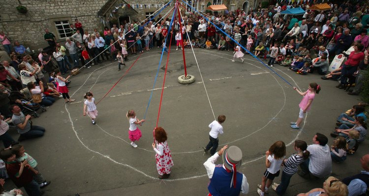 Dancing around a maypole is a popular May Day activity.