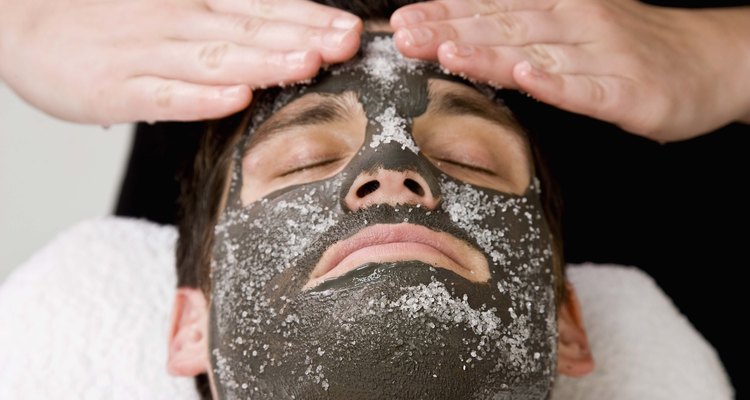 Applying skincare face mask with salt