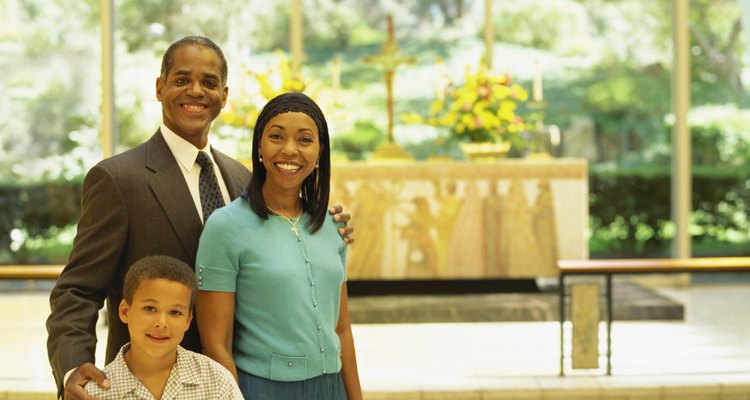 parents and their son smiling in church