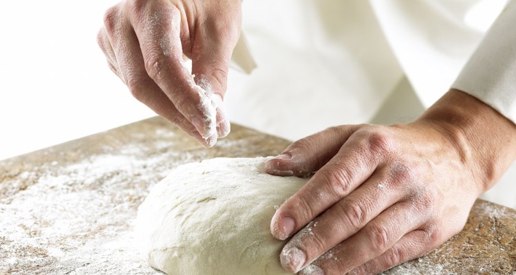 Chef rolling out dough