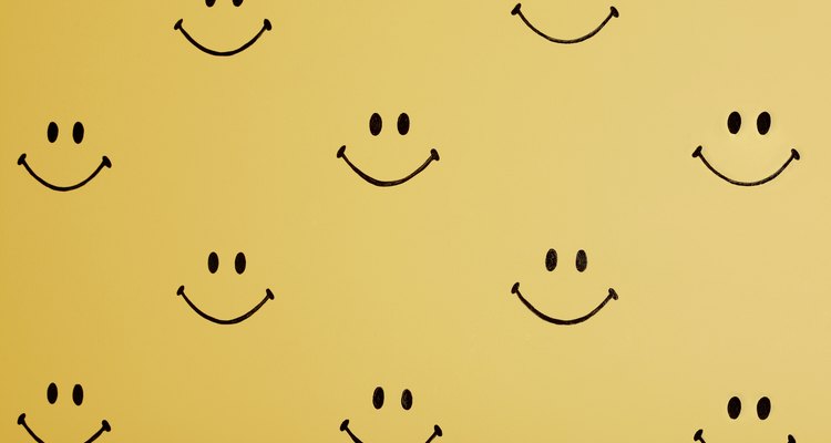 Insert smiley face symbols using the Place method in InDesign.