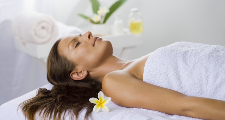 Relaxed woman lying down at a spa