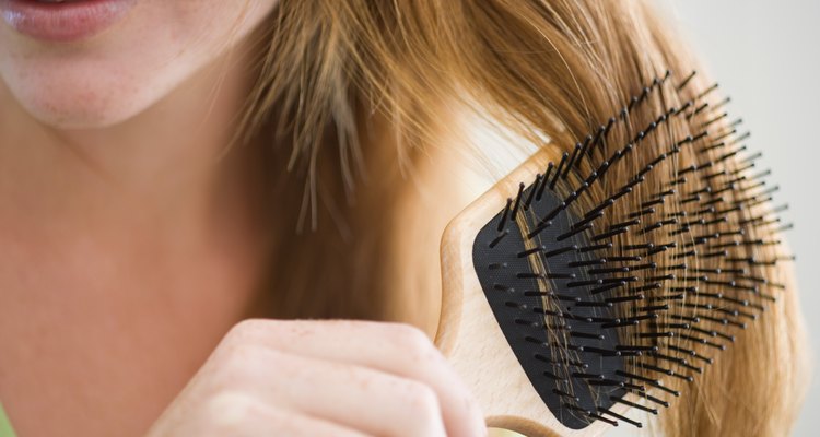 Woman combing her hair