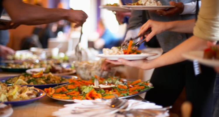 Cropped shot of people at buffet table